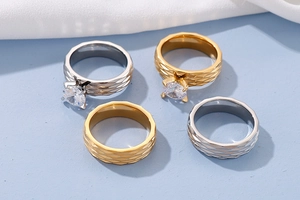 Macro view of four-piece titanium steel rings with diamond setting and rhombus texture
