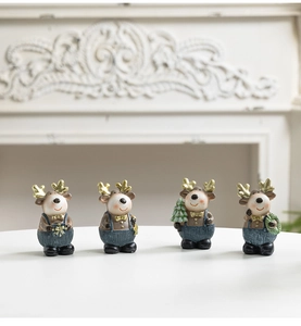 Detailed view of four resin Christmas reindeer figurines set on a mantelpiece