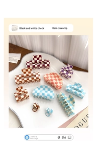 Macro view of checkered acetate hair clips in assorted candy colors on a white tray