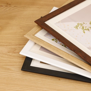 Nordic minimalist wooden photo frames in walnut, light wood, white, and black finishes