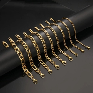 Detailed close-up of various widths of gold-plated Figaro chain bracelets for DIY jewelry