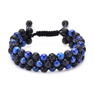 Detail of double-row woven bracelet with black lava stones and blue natural beads