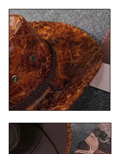Detail of vintage brown cowboy hat showing cracked leather texture and woven cord