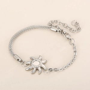 Detail of silver stainless steel sun charm bracelet with mesh and oval link chain