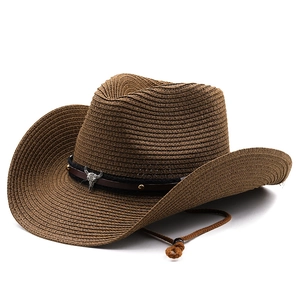Brown woven western cowboy straw hat with wide brim and bull skull leather band detail