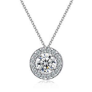 Macro shot of a sparkling halo pendant necklace with a round center stone in silver