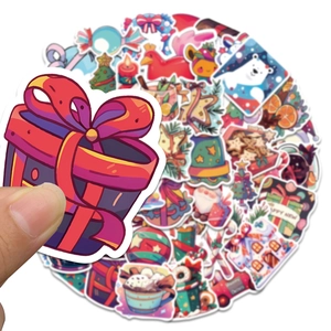 Close-up of 50pcs waterproof PVC Christmas stickers showing festive cartoon patterns