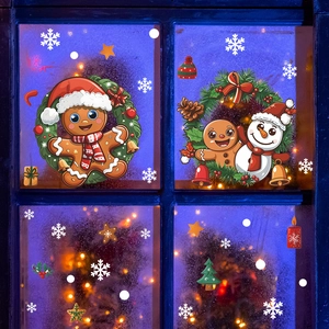Festive Christmas window stickers with gingerbread man and snowman on a window