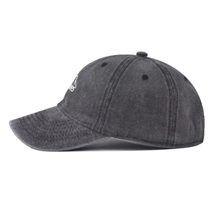Detail showing side embroidery of mountain peak on washed dark grey cotton baseball cap