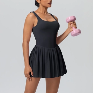 Detailed view of black tennis dress with pleated skirt and wide straps for tennis