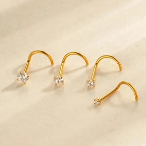 Golden G23 titanium L-shaped nose studs with round claw-set cubic zirconia stones