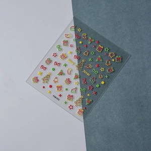 Detailed 3D embossed Christmas nail stickers featuring trees, stars, and Merry Xmas text