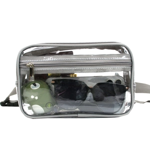 Detail view of transparent PVC waist bag with grey trim showing spacious storage capacity