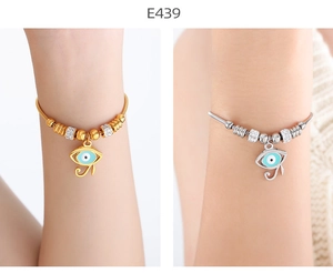 Detail view of 18k gold plated evil eye pendant bracelets with sparkling crystal accents