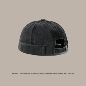 Detail of washed cotton miki hat showing retro distressed texture and metal strap adjuster