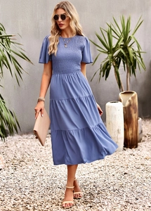 Detail view of blue short-sleeve maxi dress with shirred bodice and layered skirt