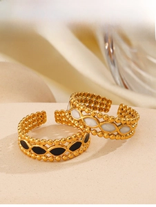 Detail of 18K gold-plated ring with black and white enamel eye patterns and beads