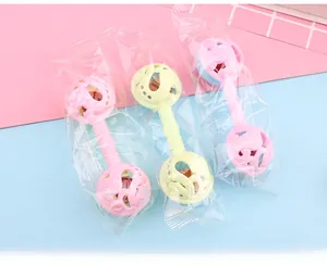 Detailed view of pastel baby rattles with textured handles for easy sensory grip
