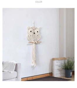 Detail of handcrafted bohemian owl wall hanging with intricate macrame weaving and tassels