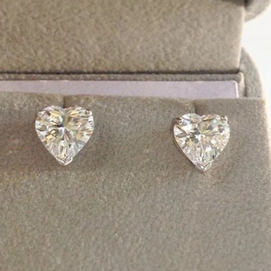 Close-up of heart-cut cubic zirconia stud earrings with a secure three-prong setting