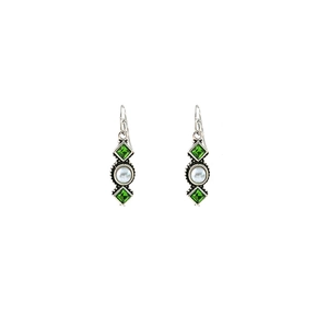 Macro detail of retro drop earrings with green gemstone, white pearl and silver frame