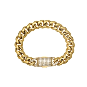 Detailed macro view of 18k gold plated Cuban link bracelet with iced-out zircon clasp