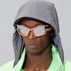 Futuristic bronze oversized sunglasses with silver mirrored lenses for a Y2K tech look