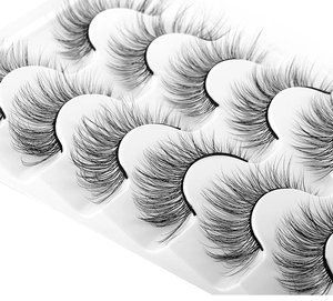 Close-up of 8 pairs of voluminous 8D faux mink lashes with natural curl in a white tray