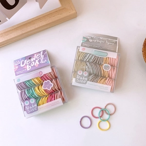 Colorful mix of 130 seamless high-elasticity baby hair ties in pastel storage boxes
