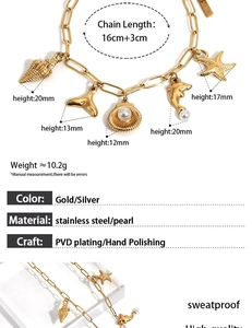 Detailed view of gold ocean charms including shell, starfish, and whale tail with pearls