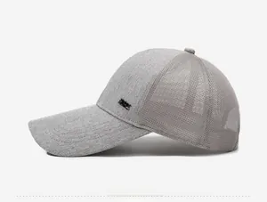 Side view of grey baseball cap featuring textured fabric and breathable mesh panels