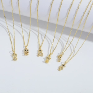 Golden bear pendant necklace with white rhinestones and fine chain jewelry display