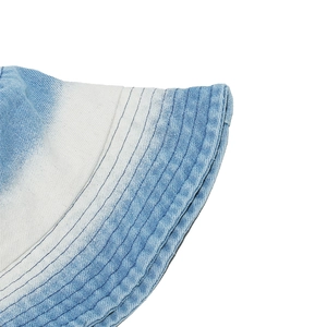 Detailed view of striped gradient denim bucket hat with precision stitching and twill texture