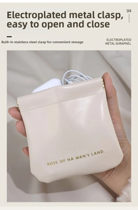 Detail view of cream PU leather pouch with automatic squeeze metal closure and data cable inside