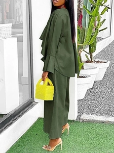 Side view of olive green two-piece set featuring ruffle long sleeve top and wide leg pants
