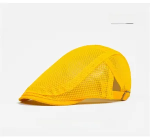 Detail view of breathable yellow mesh fabric and metal adjustment buckle on the flat cap