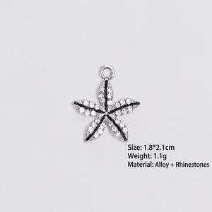 Detailed view of starfish pendant with white crystals and dimensions 1.8x2.1cm