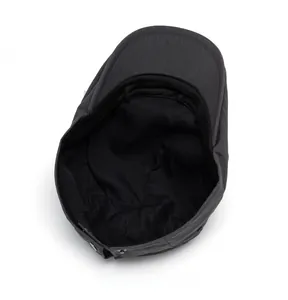 Detail view of the dark grey striped beret internal lining and metallic buckle