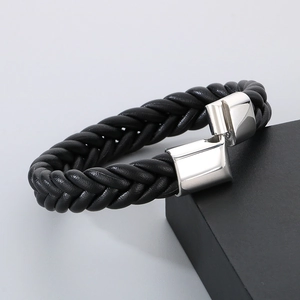 Men's braided leather bracelet with polished stainless steel clasp on display box