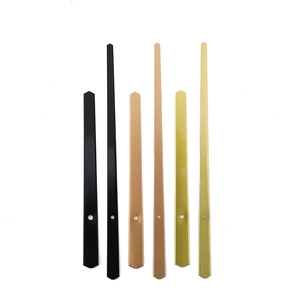 Three sets of minimalist metal clock hands in black, rose gold, and gold finishes