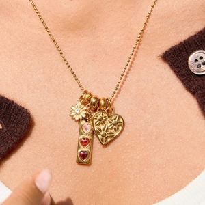 18K gold plated necklace with daisy, heart, and gemstone pendants on beaded chain