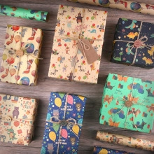 Detail of premium kraft gift wrapping paper with colorful cartoon dinosaur patterns