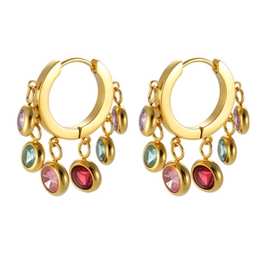 Detail of gold hoop earrings featuring multi-colored dangling zircons on white background
