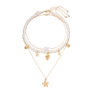Vintage gold layered necklace with white pearls, seashell and starfish pendants for summer
