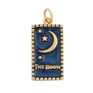 Close-up of a gold-framed blue enamel tarot pendant with The Moon and star motifs