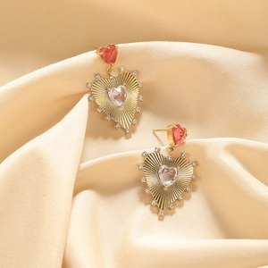 Gold heart drop earrings with red crystal studs and radiant texture for women