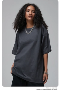 Detail of dark grey oversize cotton t-shirt with ribbed crew neck and premium knit texture