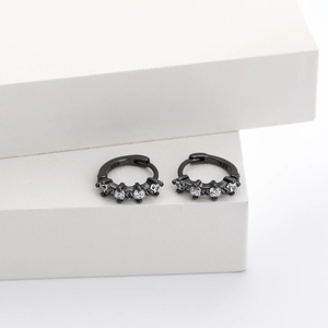 Detailed macro view of black plated S925 silver hoop earrings with clear zircon stones