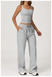 Detail of high waisted wide leg joggers with drawstring and center seam styling
