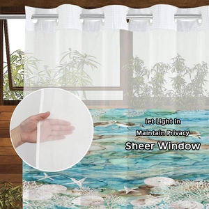 Close-up of semi-transparent ocean themed shower curtain with durable silver metal rings